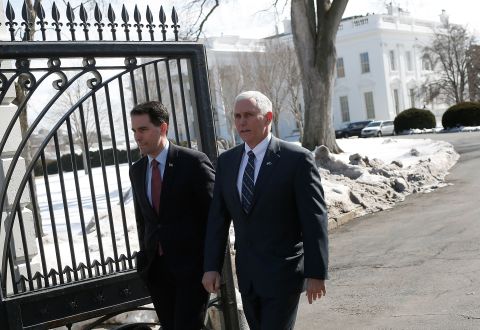 Wisconsin Gov. Scott Walker, left, and Pence depart the White House after President Obama addressed members of the National Governors Association on February 23 in Washington.