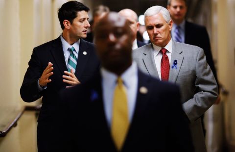 Rep. Paul Ryan of Wisconsin, left, talks with Pence, then a congressman, as they head to a Republican conference meeting at the U.S. Capitol on July 25, 2011.