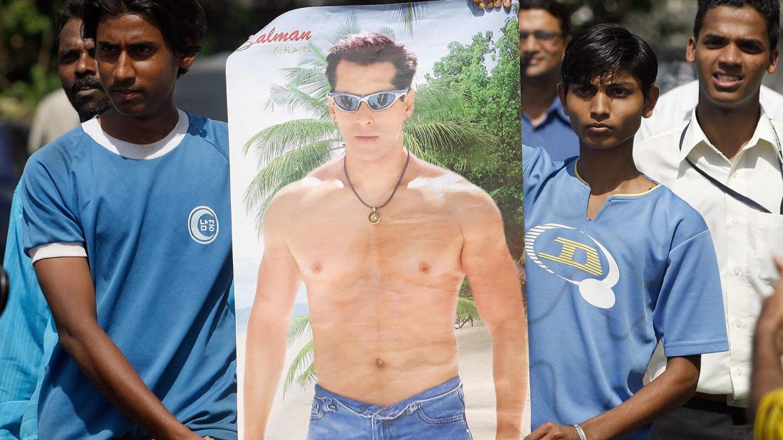 Khan fans carry his poster outside the actor's residence in Mumbai in 2007. They were there in support of the actor who was facing five years in jail for killing a rare gazelle.   