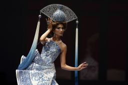 A model showcases a porcelain-inspired design by Guo Pei during Fashion Week 2013 in Singapore. 