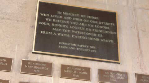 A plaque under a Pittsburgh highway commemorates the homeless men and women who have died.