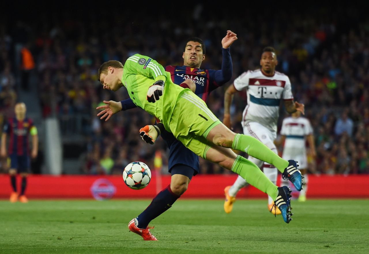 Luis Suarez of Barcelona and Manuel Neuer of Bayern Muenchen compete for the ball during the UEFA Champions League Semi Final, first leg match between FC Barcelona and FC Bayern Muenchen at Camp Nou on May 6, 2015 in Barcelona, Spain. 