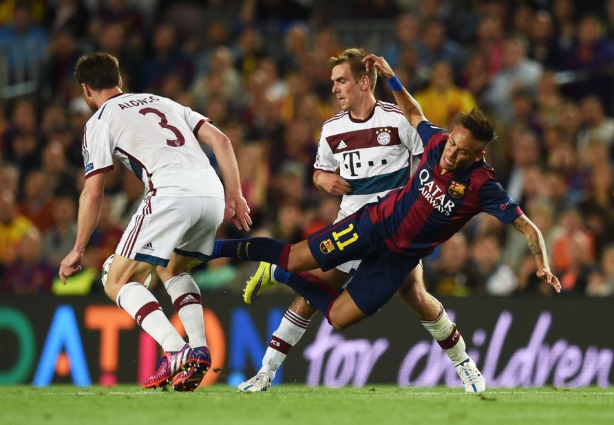  Neymar of Barcelona is tackled by Xabi Alonso of Bayern Muenchen during the UEFA Champions League Semi Final, first leg match between FC Barcelona and FC Bayern Muenchen at Camp Nou on May 6, 2015 in Barcelona, Spain.