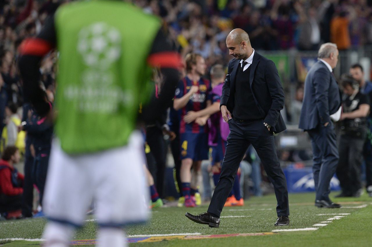 Bayern Munich's Spanish head coach Pep Guardiola looks down during the UEFA Champions League football match FC Barcelona vs FC Bayern Muenchen at the Camp Nou stadium in Barcelona on May 6, 2015.