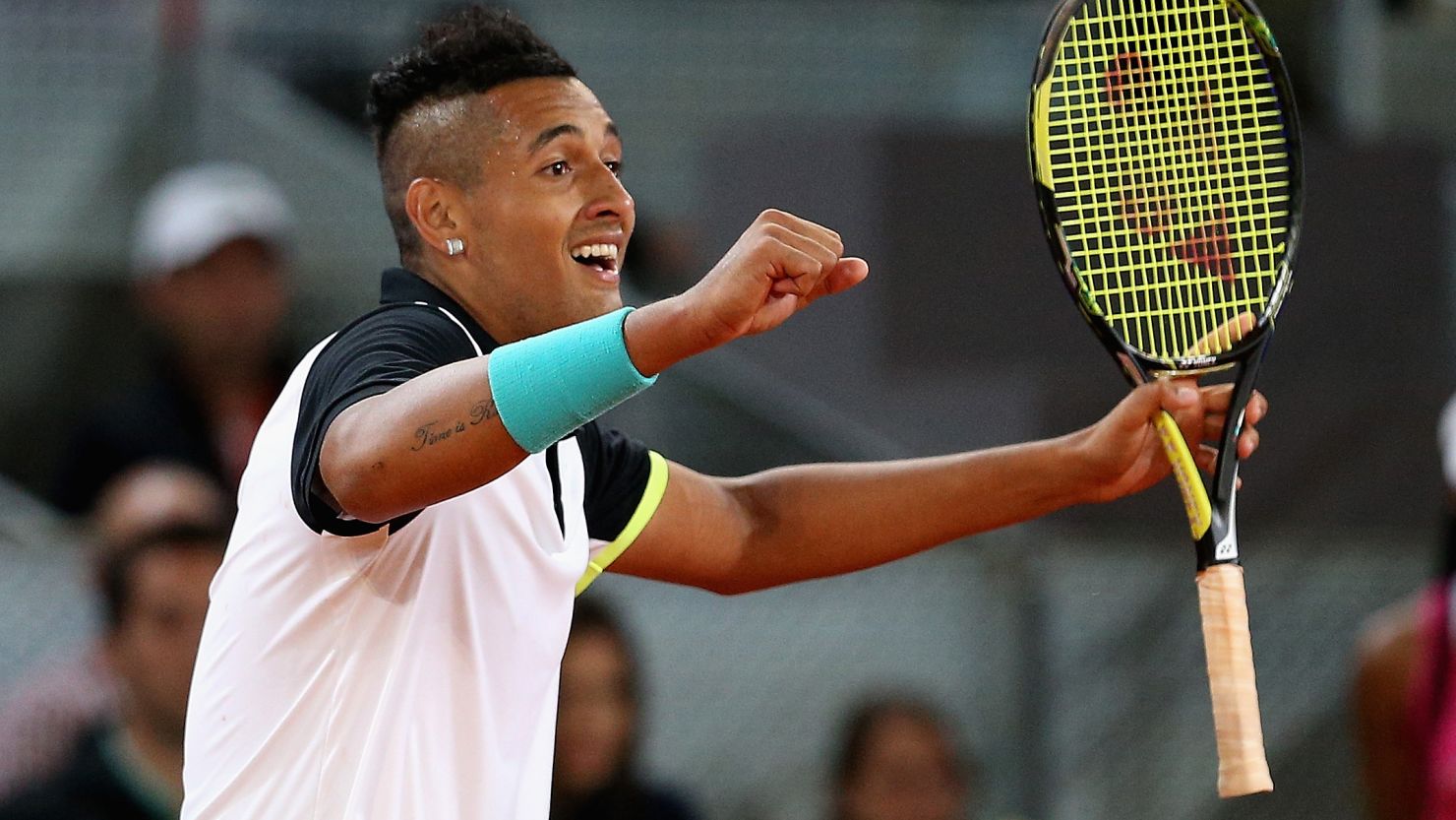 Nick Kyrgios celebrates match point against Swiss tennis great Roger Federer in their second-round match in Madrid.