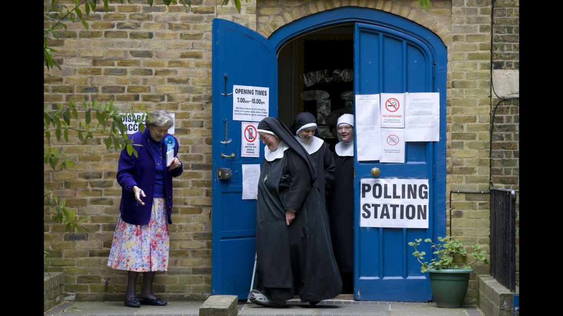 Nuns leave a polling station after voting in London on May 7.
