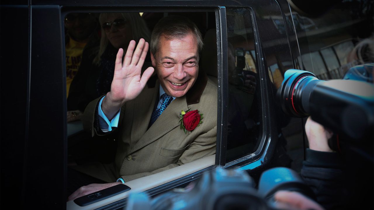 Nigel Farage, leader of the UK Independence Party, waves from his car after casting his vote in Ramsgate, Kent, England.