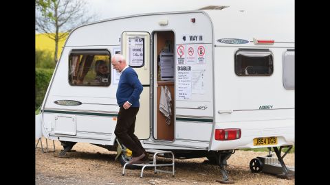 A man leaves after casting his vote in a trailer in Garthorpe, England.