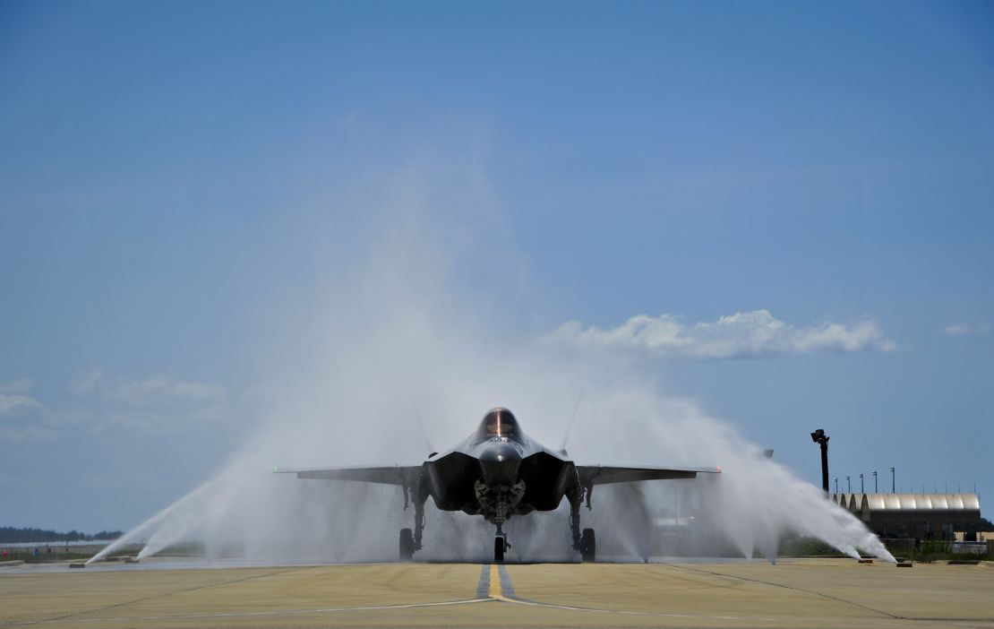 Lt. Col. Christine Mau navigates her F-35A through the "bird bath" after returning from her first flight on Eglin Air Force Base, Florida, on Tuesday.