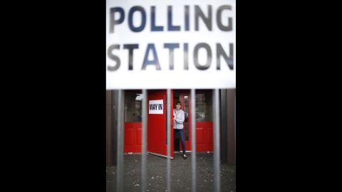 A woman leaves a polling station in West Belfast, Northern Ireland.
