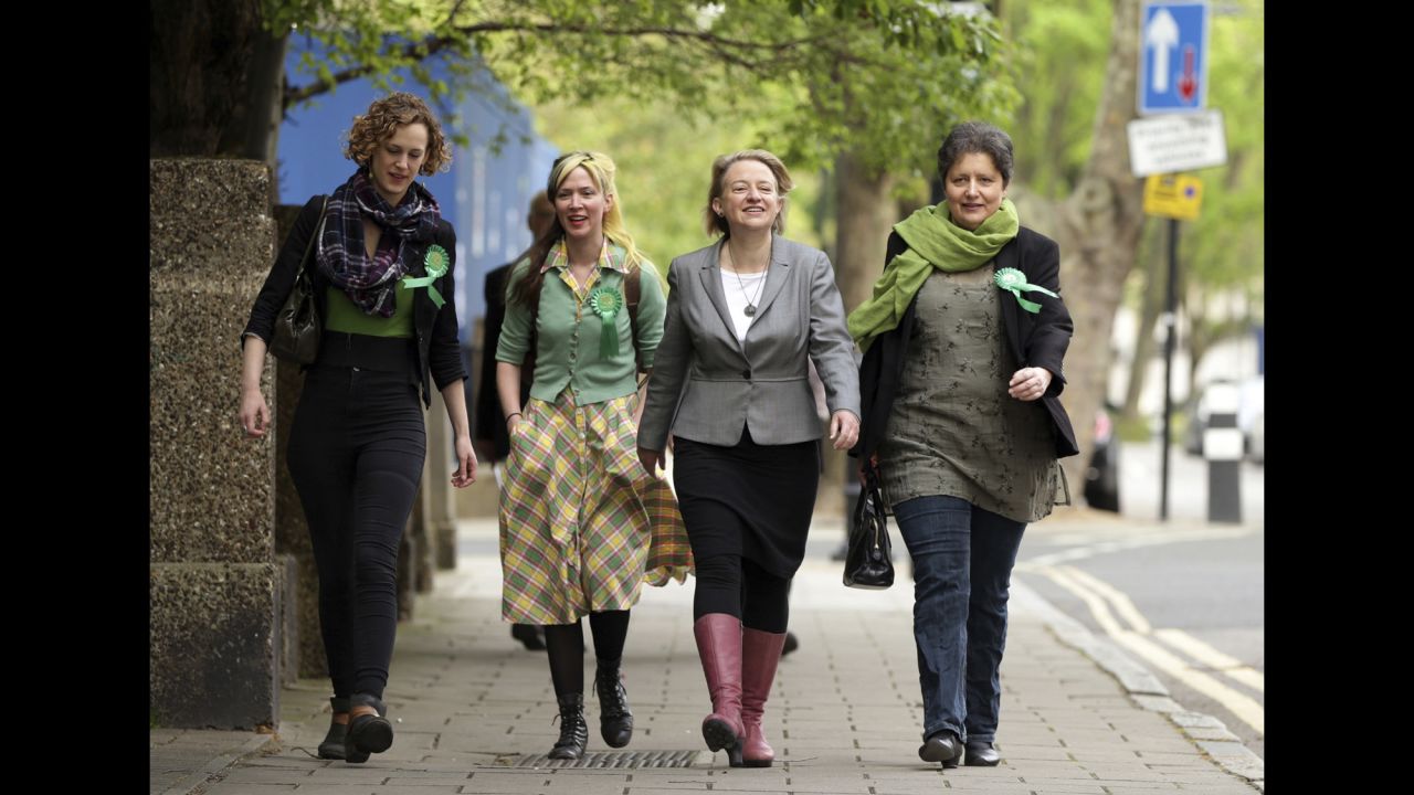 Green Party leader Natalie Bennett, second from right, arrives to vote in London.