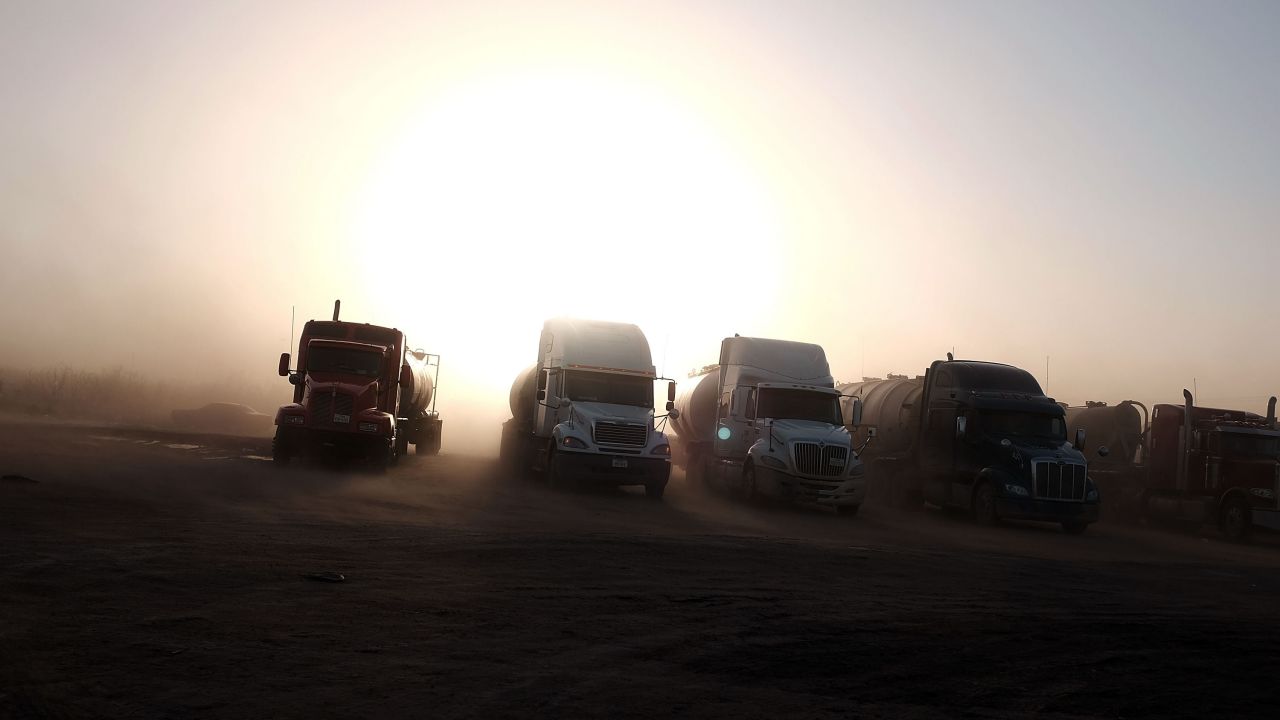 Trucks used in the fracking industry sit at a truck stop in Odessa, Texas, on February 4.