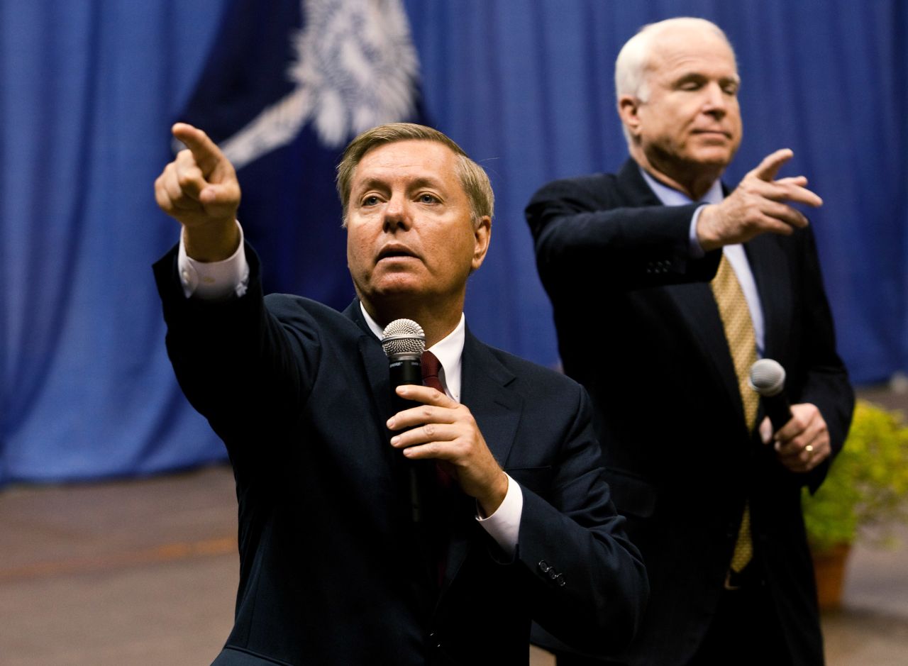 Graham, left, and McCain call on participants during a health care town hall meeting on September 14, 2009 at the Citadel in Charleston, South Carolina. According to his website, Graham is a native South Carolinian and grew up in a blue collar family in the small town of Central, where his parents ran a restaurant and pool hall.