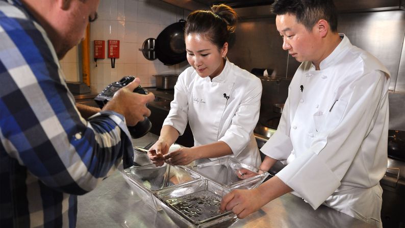 Vicky Lau, chef and owner of Tate Dining Room in Hong Kong, travels to Hangzhou to learn about the city's iconic dish from Cheng (right). 