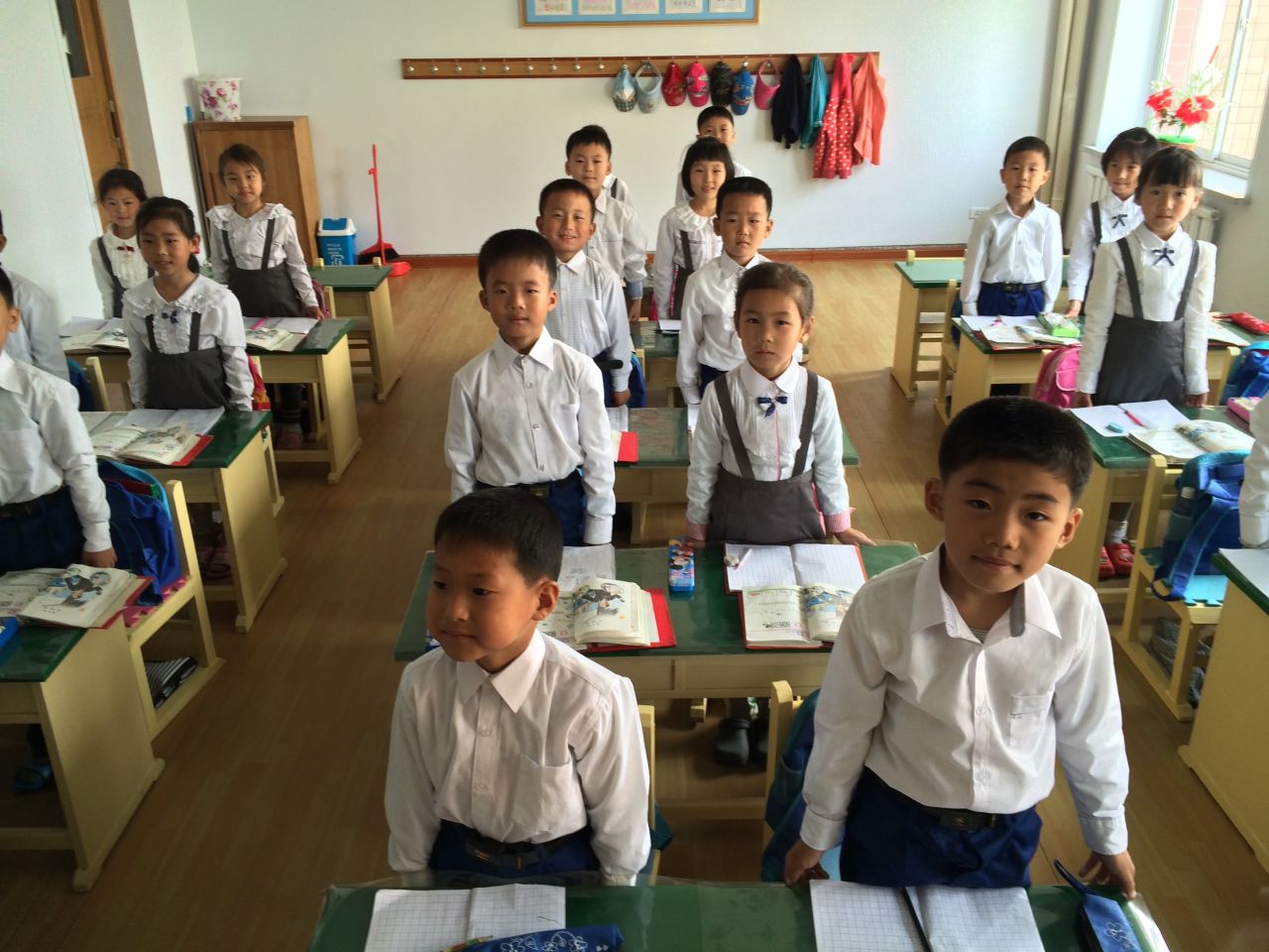 First graders in a Pyongyang classroom are orderly yet energetic, often standing and giving spirited answers to their teacher's questions.