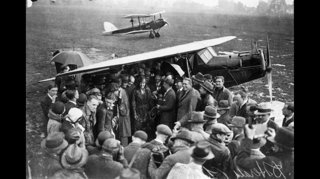 Amelia Earhart is surrounded by a crowd of well-wishers and reporters on arrival at Hanworth Air Park in England after crossing the Atlantic in 1932.  