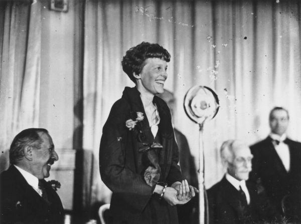 Earhart addresses journalists during a lunch in London on May 23, 1932. Her triumphant crossing was not without difficulties. Shortly after taking off from Newfoundland, she encountered thick clouds and ice on the wings of her plane. Mechanical problems later in the flight informed her decision to land in Northern Ireland.