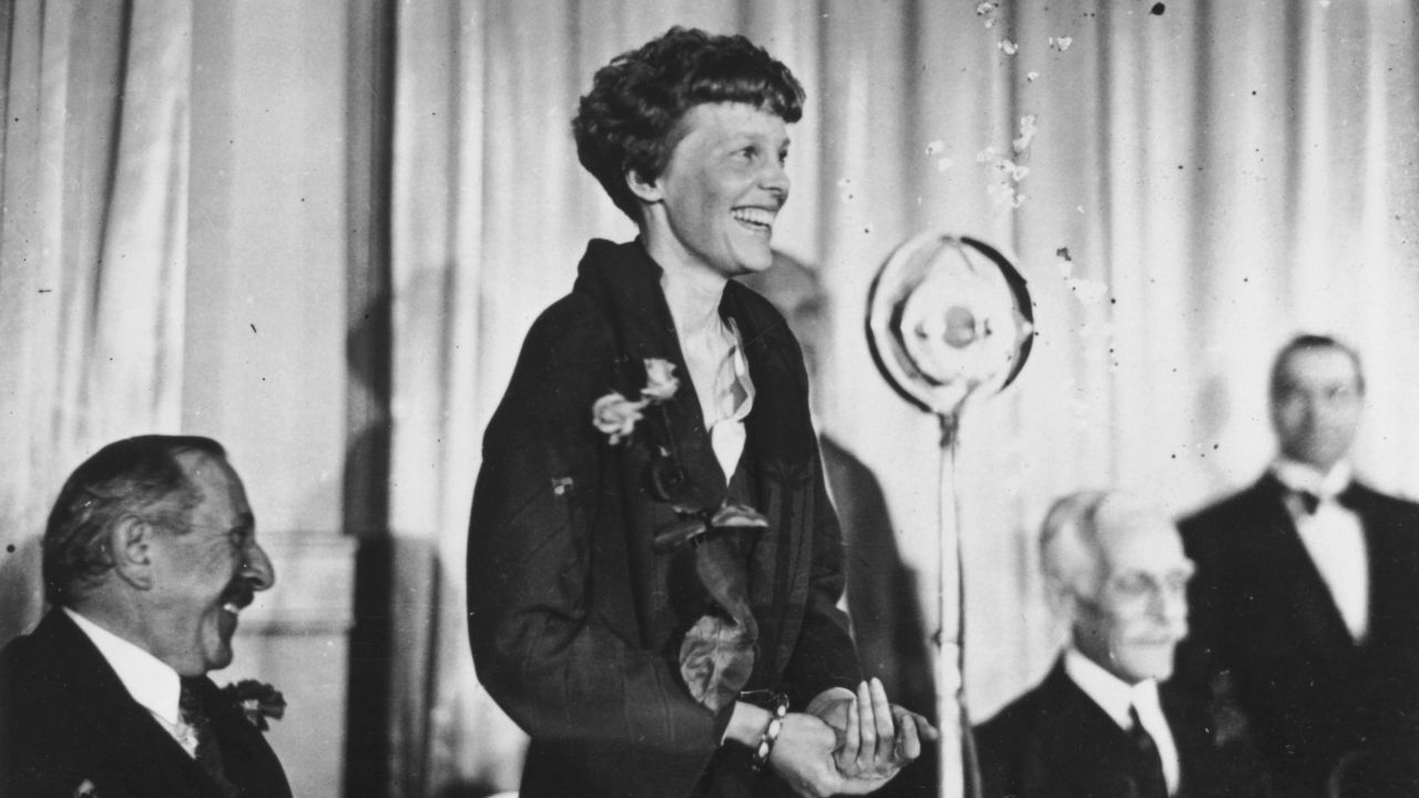 Amelia Earhart addresses journalists during lunch at the Criterion, London, in May 1932.