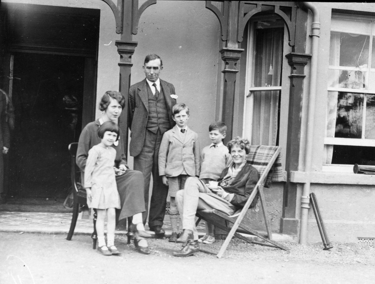 Earhart poses with the Gallagher family in Londonderry on May 24, 1932. Earhart landed her plane in the family's field after her solo flight across the Atlantic.