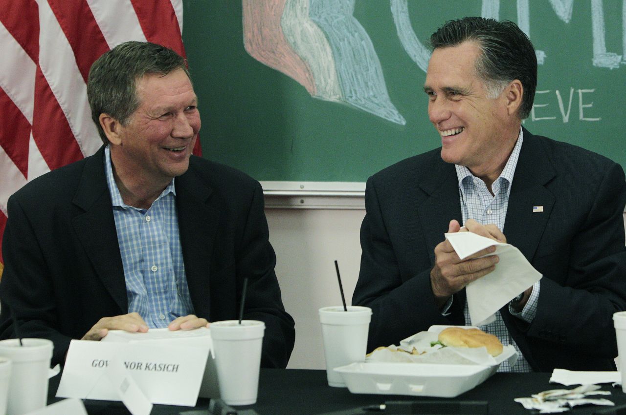 Kasich, left, and then-Republican presidential candidate Mitt Romney  talk with students during a roundtable discussion at Otterbein University on April 27, 2012 in Westerville, Ohio. Romney eventually won the 2012 GOP presidential nomination.