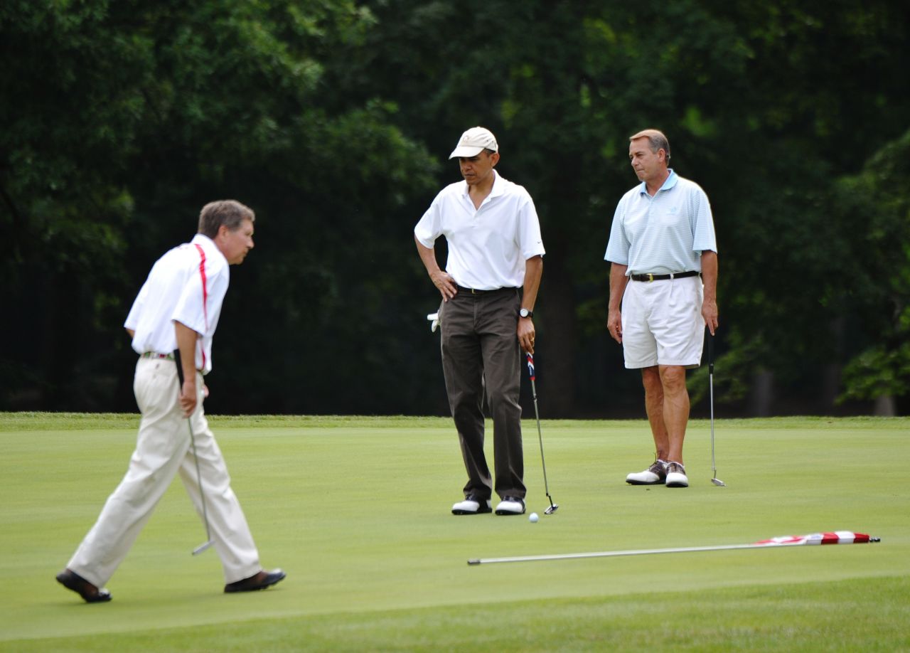 Kasich, left, President Barack Obama, center, and Republican House Speaker John Boehner play the first hole of a golf game on June 18, 2011, at Andrews Air Force Base in Maryland.