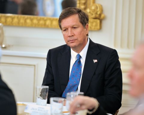 Kasich listens to Obama speak during a bipartisan meeting of governors hosted by the President and Vice President Joe Biden in the State Dining Room of the White House on February 28, 2010.