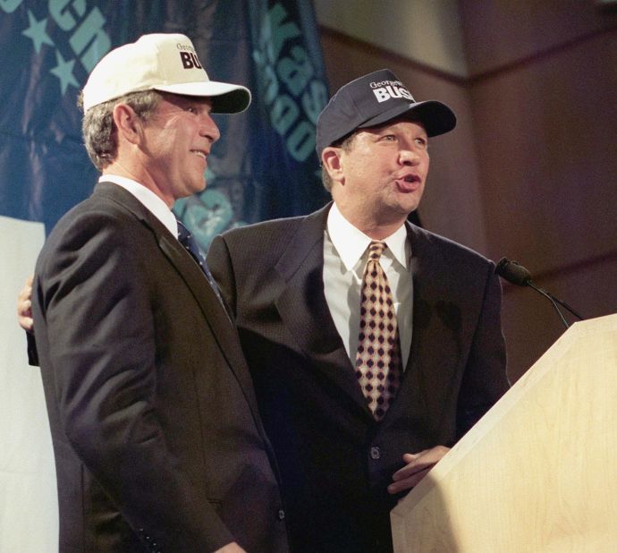 Kasich, right, then a member of the U.S. House, sports "Bush" baseball caps with Texas Gov. George W. Bush on July 14, 1999. The two lawmakers held a news conference at the Ronald Reagan International Trade Center in Washington during Bush's presidential run. Kasich had previously announced that he was withdrawing from the 2000 presidential race and endorsed Bush.