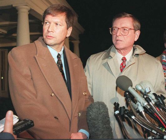 During a U.S. government shutdown, Kasich, left, and Sen. Pete Domenici, R-New Mexico, speak to reporters outside the White House on January 6, 1996.