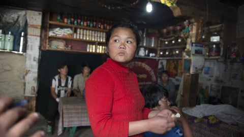 A woman who runs a small restaurant has few customers. Sherpas who serve the tourist community are hurting after two failed Everest climbing seasons.