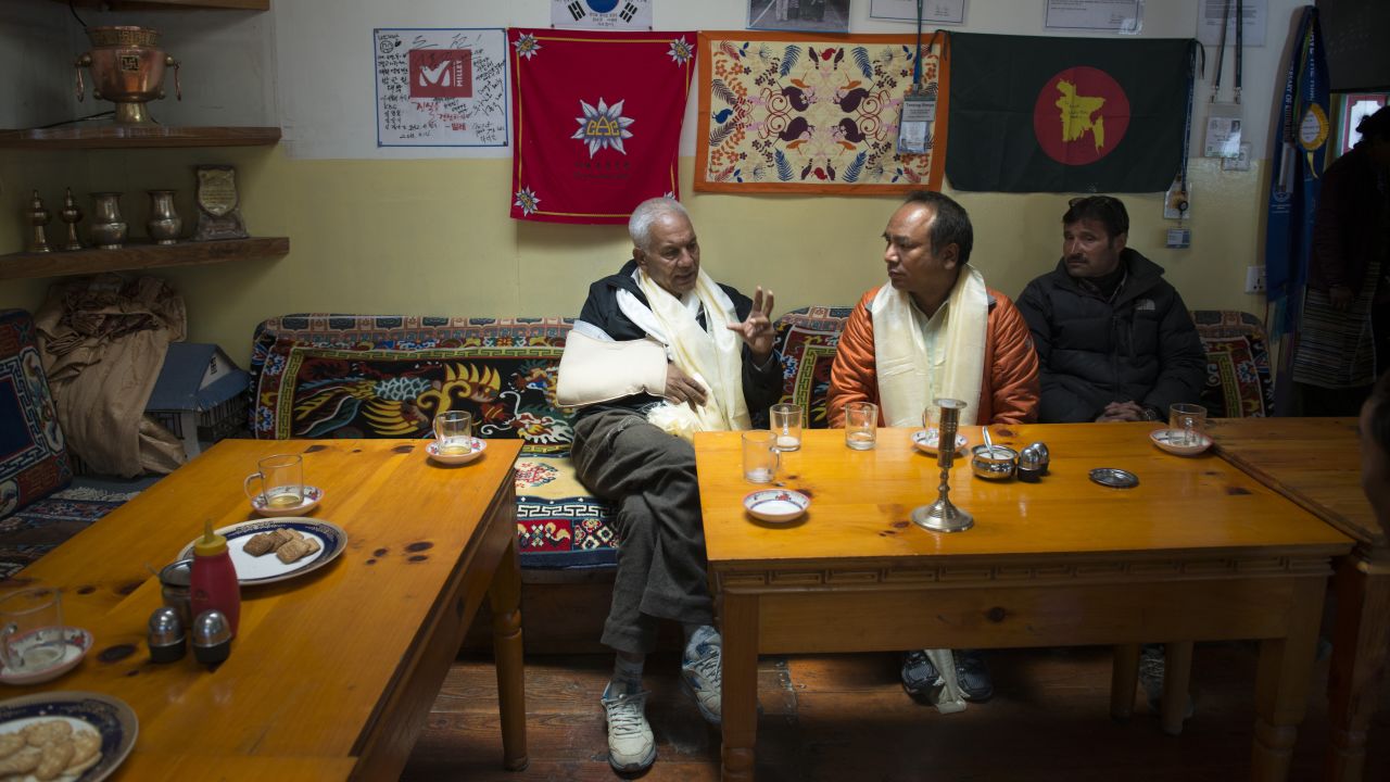 Phurba Sherpa, center, discusses the earthquake's toll with Bal Bahadur KC, left, a member of Nepal's Parliament who represents the district in which most of the affected Sherpa villages fall.