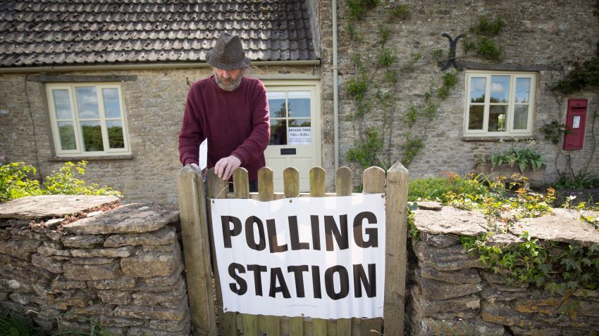 A voter enters a polling station located in the Old Post Office in the village of Brokenborough near Malmesbury on May 7, 2015 in Wiltshire, England