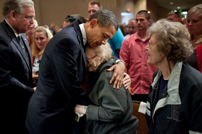 Consoling families affected by the deadly tornadoes in Joplin, Missouri, on May 29, 2011.