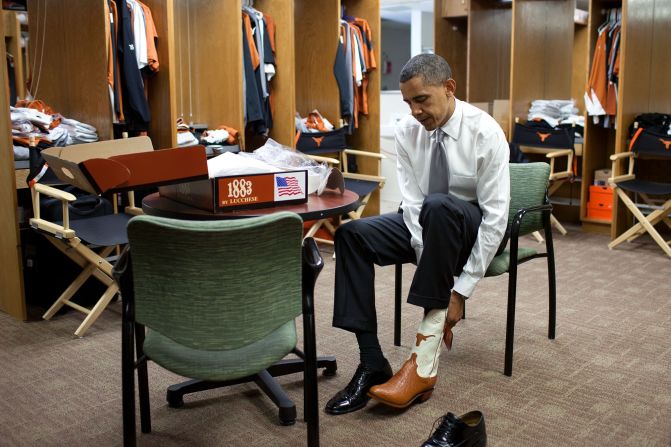 Trying on a pair of cowboy boots at the University of Texas in Austin on August 9, 2010.