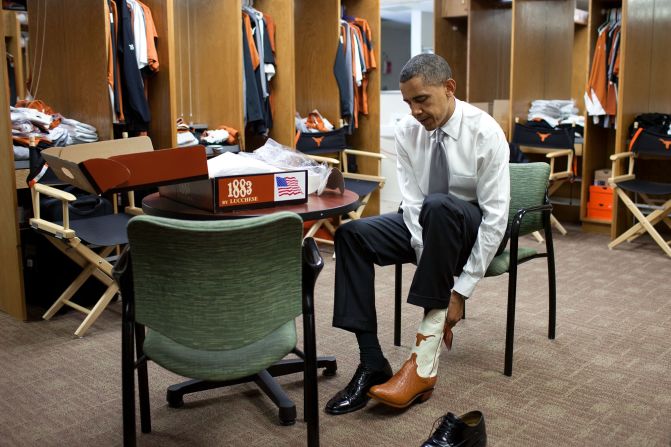 Trying on a pair of cowboy boots at the University of Texas in Austin on August 9, 2010. 