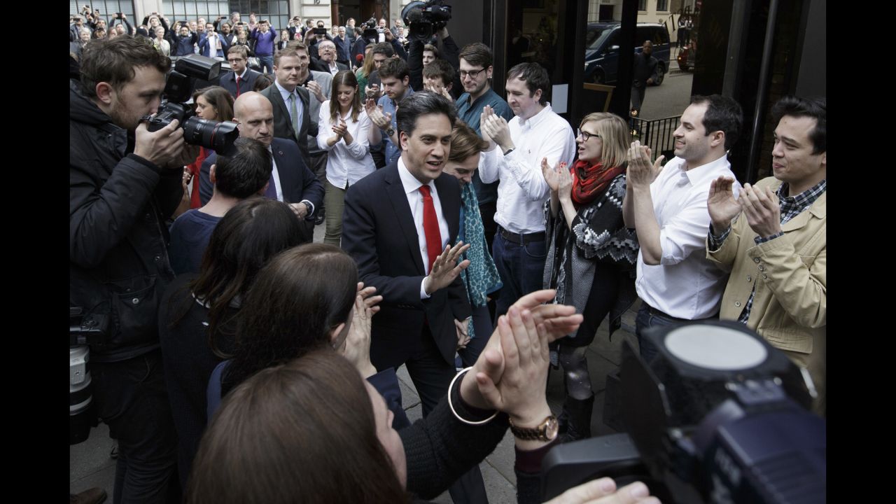 Labour Party leader Ed Miliband arrives with his wife Justine at the Labour Party headquarters in London on May 8. Miliband retained his seat during the election but said it was a "clearly disappointing night."