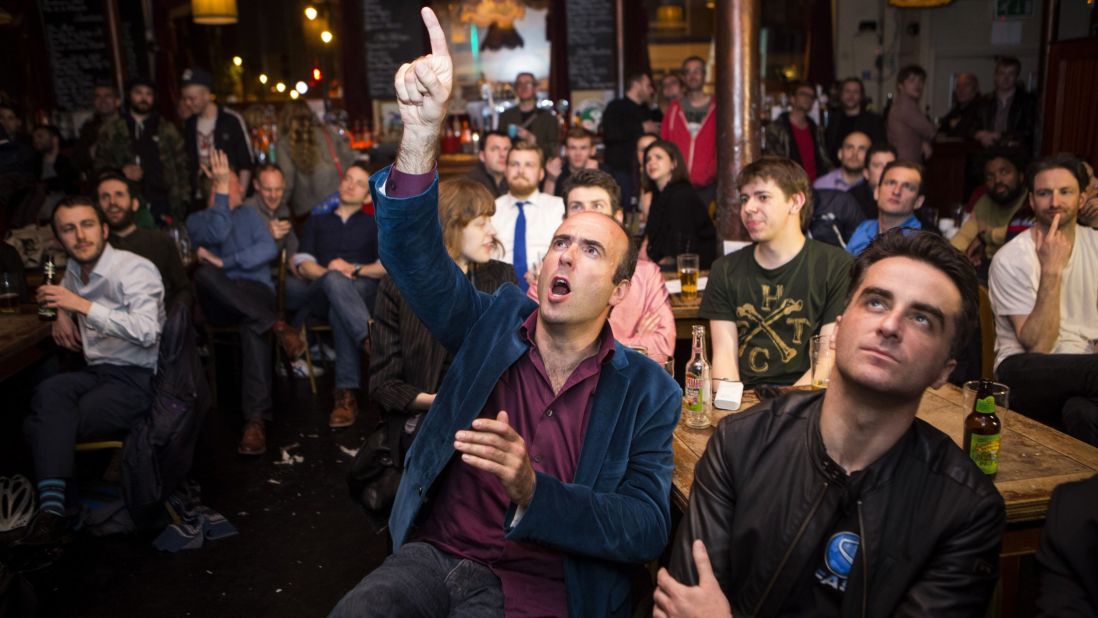 A man reacts in a pub in London as it is announced that London Mayor Boris Johnson won his seat in Parliament on May 8.