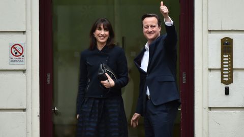 British Prime Minister David Cameron and his wife, Samantha, arrive at the Conservative Party headquarters in London on Friday, May 8. Cameron stays in power with his party, the Conservatives, stronger than at the last election in 2010.