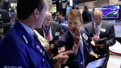 Trader Robert  Charmak, center, works on the floor of the New York Stock Exchange Thursday, May 7, 2015. U.S. stocks are opening mostly lower, pushing the Dow Jones industrial average into the red for the year. 