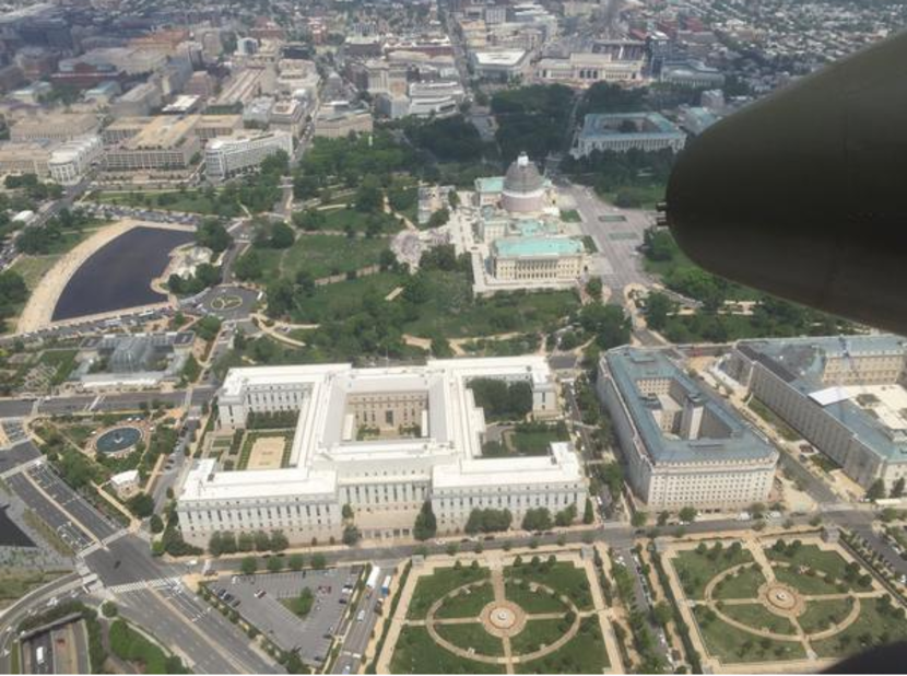 The B-25 flies past the U.S. Capitol.