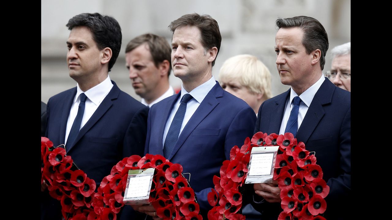 British Prime Minister David Cameron, right, attends a V-E Day service at the Cenotaph in London. Next to Cameron is outgoing Liberal Democratic Party leader Nick Clegg, center. Outgoing Labour Party leader Ed Miliband is at far left.