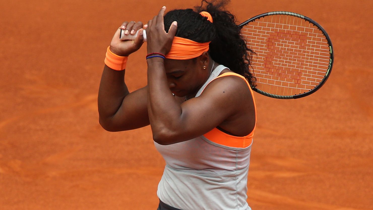 Serena Williams puts her head in her hands during the defeat by Petra Kvitova in the Madrid Open.