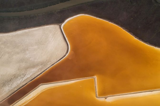 High school teacher Jeff Goodman captured this shot of a salt mine while flying near the Californian city of San Francisco last year. The bright colors of the water are determined by the different algae present and the salinity of the water.