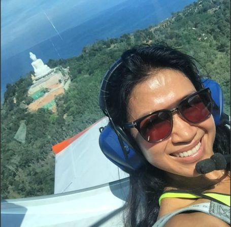 Simon Hand, producer of nationally televised TV show 'Phuket Today,' captured this image of Phuket's skyline with presenter Rose Smith. The Big Buddha, which is still under construction, is visible in the background.