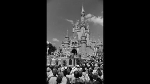 A crowd in Orlando waits for Walt Disney World's Main Street to open in October 1971. The park cost an estimated $400 million to build and now attracts around 25 million visitors annually. When Disney World opened in 1971, the price for admission was $3.50. A single-day ticket now is $105 for anyone over 10 years old.