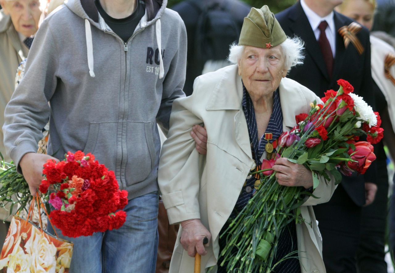 Visitors arrive to lay flowers near the tomb of the Unknown Soldier at the Antakalnis memorial during Victory Day celebrations in Vilnius, Lithuania, on May 9. Lithuania was part of the Soviet Union during World War II.