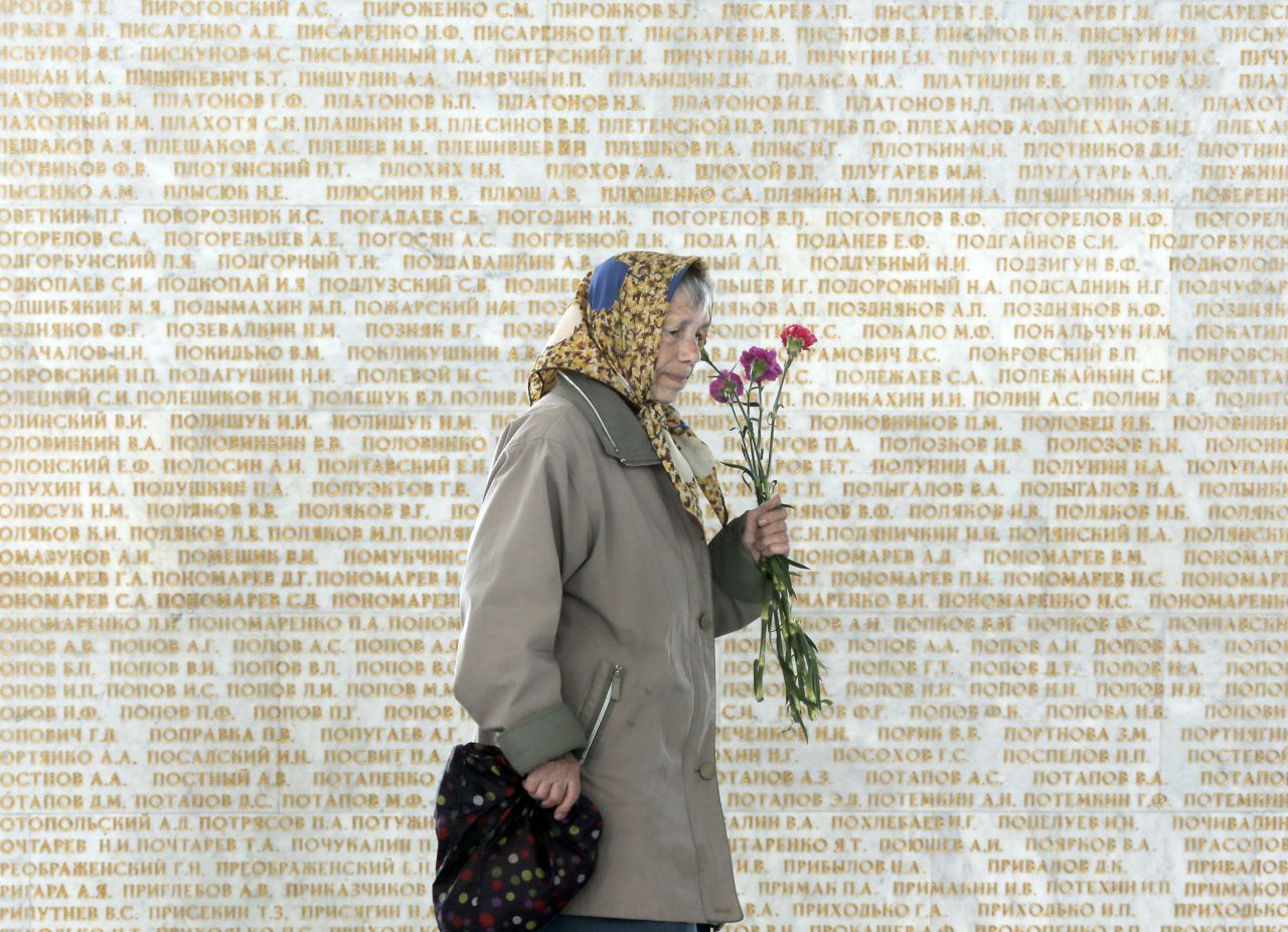 An elderly woman passes by a wall engraved with the names of the Soviet Union Heroes, during the 70th anniversary of the victory over Nazi Germany, in Ukraine's capital Kiev, on May 9. Ukrainians mark the World War II anniversary and Victory Day on May 9 as a national holiday.