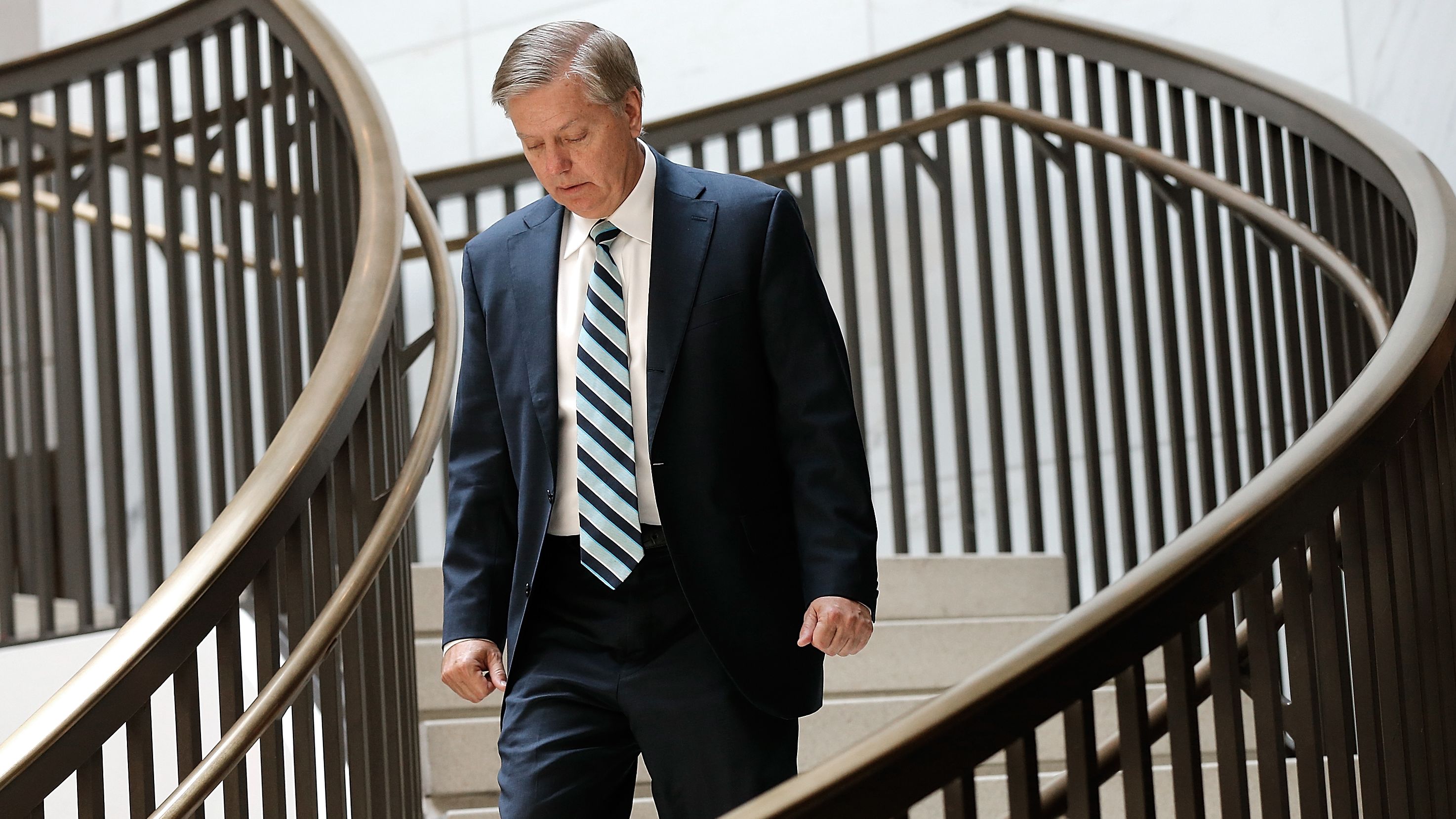 Sen. Lindsey Graham (R-SC) arrives for a Senate Armed Services Committee closed briefing July 30, 2014 in Washington, D.C. 