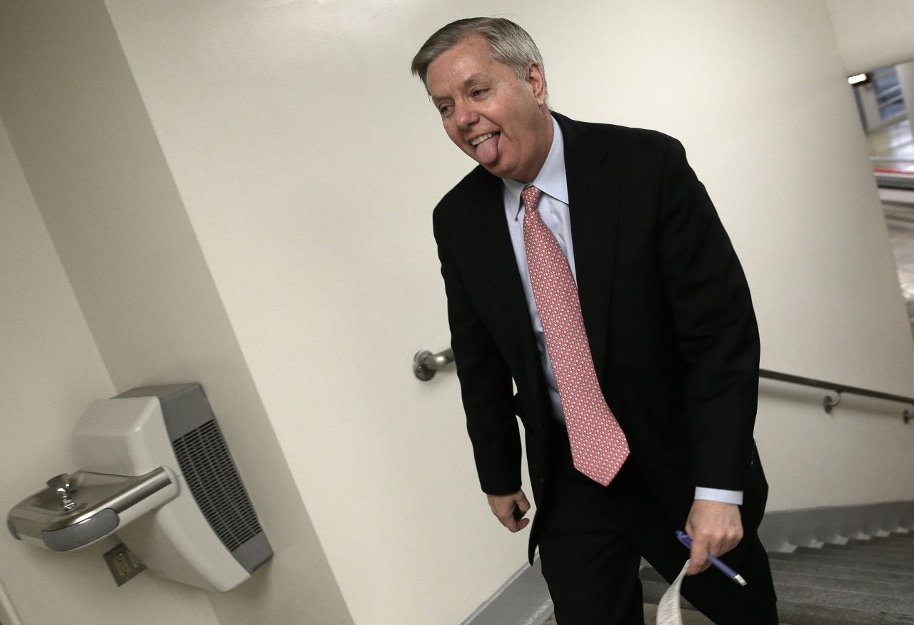 Graham rushes to the Senate chamber to vote on an attempt to override U.S. President Barack Obama's veto of the Keystone XL Pipeline legislation March 4, 2015. Graham was elected to the U.S. Senate in 2002 and was re-elected in 2008 and 2014. 