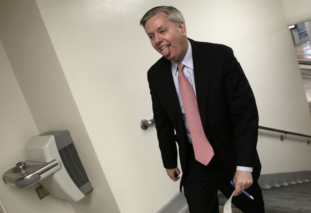Graham rushes to the Senate chamber to vote on an attempt to override U.S. President Barack Obama's veto of the Keystone XL Pipeline legislation March 4, 2015. Graham was elected to the U.S. Senate in 2002 and was re-elected in 2008 and 2014.