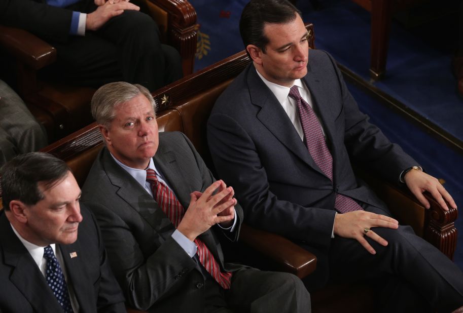Graham and U.S. Sen. Ted Cruz, R-Texas, right, listen as President Barack Obama delivers the State of the Union address on January 28, 2014. Graham was in the U.S. Air Force and logged six-and-a-half years of service on active duty as an Air Force lawyer. 